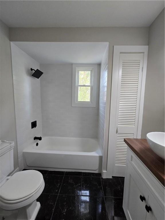 bathroom featuring toilet, bathing tub / shower combination, tile patterned flooring, and vanity