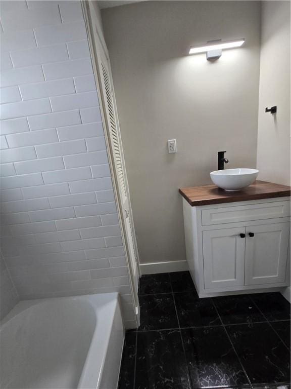 506 Luce St, Elmira-City, NY 14904 - bathroom featuring vanity, tile patterned flooring, and baseboards