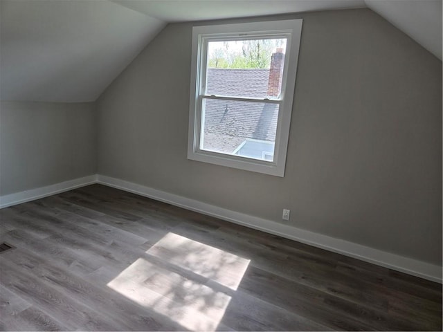 506 Luce St, Elmira-City, NY 14904 - bonus room with lofted ceiling, wood finished floors, and baseboards