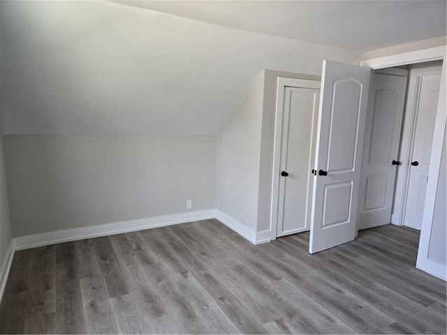 506 Luce St, Elmira-City, NY 14904 - additional living space featuring wood finished floors, vaulted ceiling, and baseboards