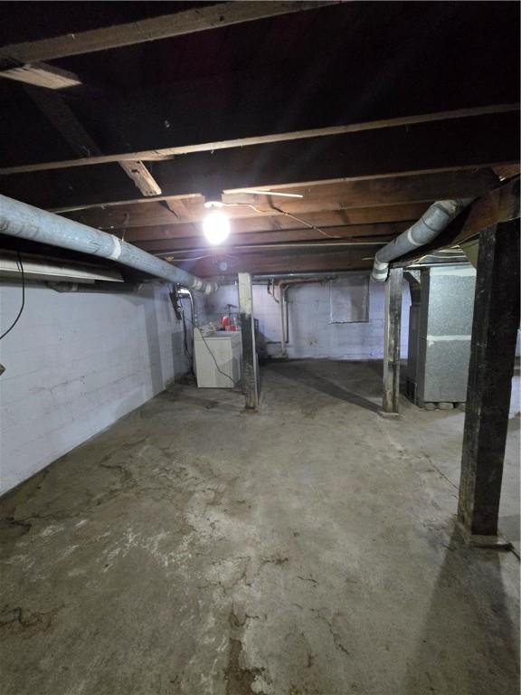 unfinished below grade area featuring washer / clothes dryer