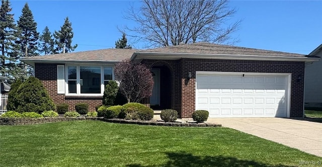 single story home featuring concrete driveway, brick siding, an attached garage, and a front yard