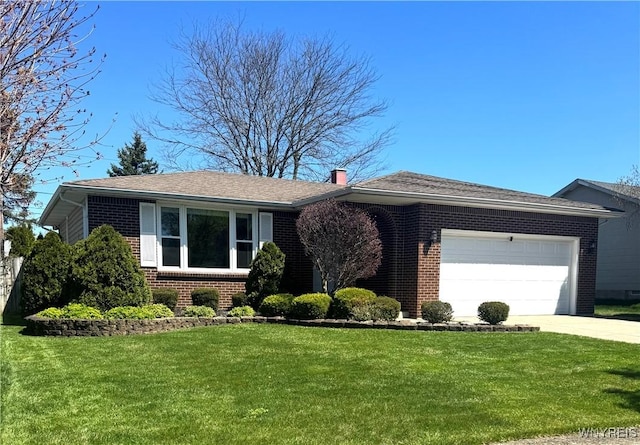single story home featuring brick siding, driveway, a front yard, and a garage