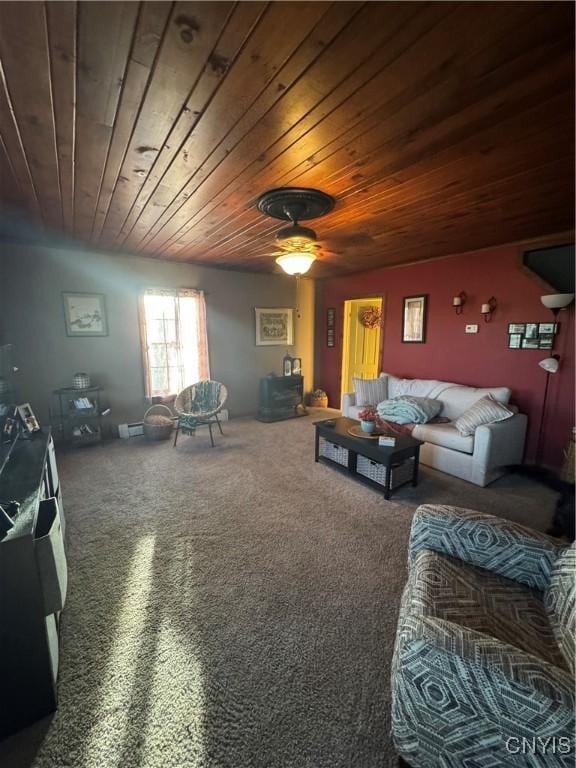 carpeted living area featuring a ceiling fan and wood ceiling