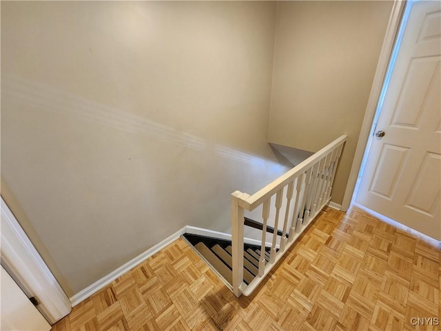 stairs featuring baseboards