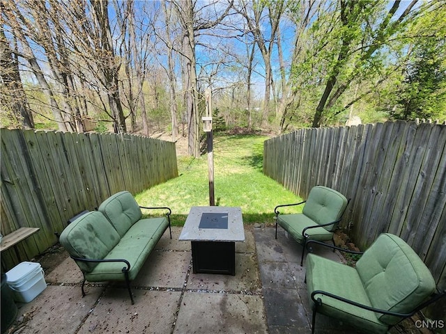 view of patio with a fenced backyard and an outdoor fire pit