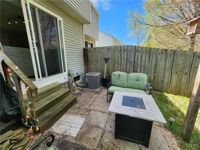 view of patio featuring fence, cooling unit, and entry steps