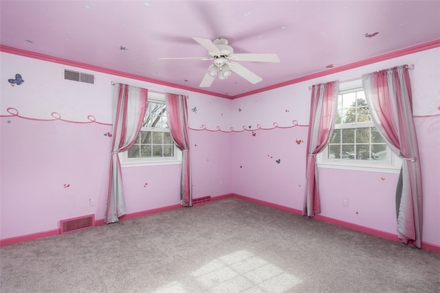 unfurnished bedroom with carpet floors, visible vents, and multiple windows