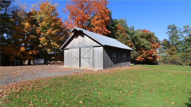 view of barn with a yard