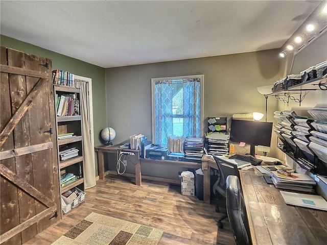 home office with wood finished floors