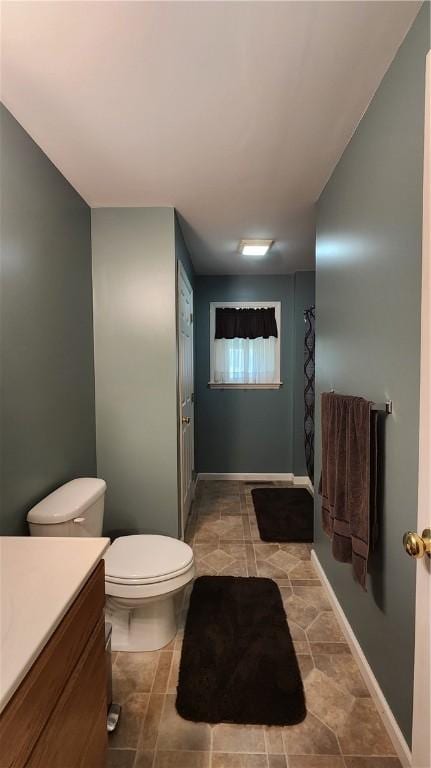 full bathroom with vanity and toilet