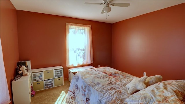 carpeted bedroom with a ceiling fan