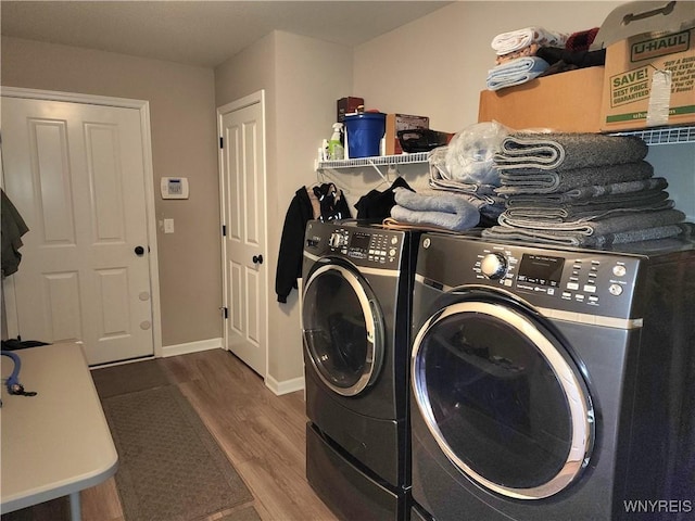 5260 Murphy Rd, Orchard Park, NY 14127 - laundry area featuring laundry area, baseboards, independent washer and dryer, and wood finished floors
