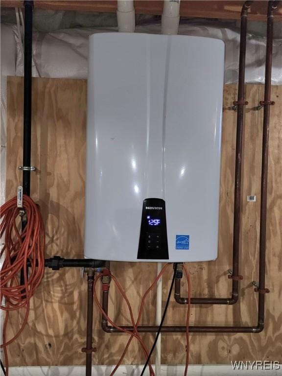 5260 Murphy Rd, Orchard Park, NY 14127 - utility room featuring tankless water heater