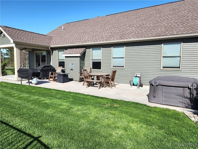 5260 Murphy Rd, Orchard Park, NY 14127 - rear view of property with a lawn, a patio, a shingled roof, and a hot tub