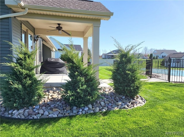 5260 Murphy Rd, Orchard Park, NY 14127 - view of yard with fence, a ceiling fan, and a fenced in pool