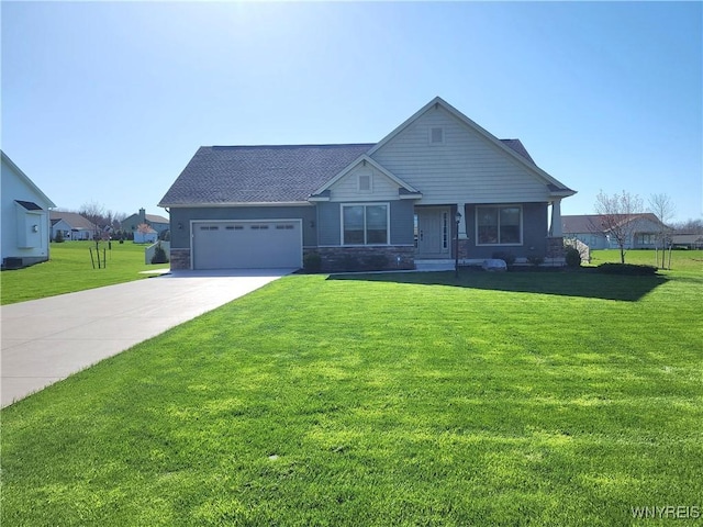 5260 Murphy Rd, Orchard Park, NY 14127 - view of front of house featuring a garage, driveway, stone siding, and a front lawn