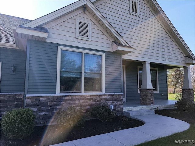 5260 Murphy Rd, Orchard Park, NY 14127 - craftsman-style home featuring a porch and stone siding