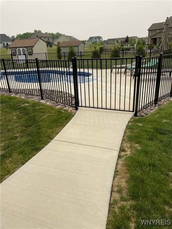 5260 Murphy Rd, Orchard Park, NY 14127 - view of swimming pool featuring a lawn, fence, a residential view, and a fenced in pool