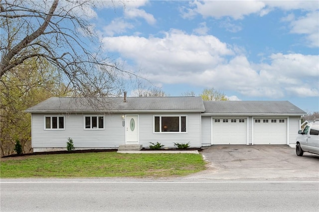 single story home with driveway, a front lawn, entry steps, and a garage