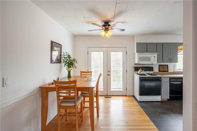 dining space featuring ceiling fan, visible vents, plenty of natural light, and french doors