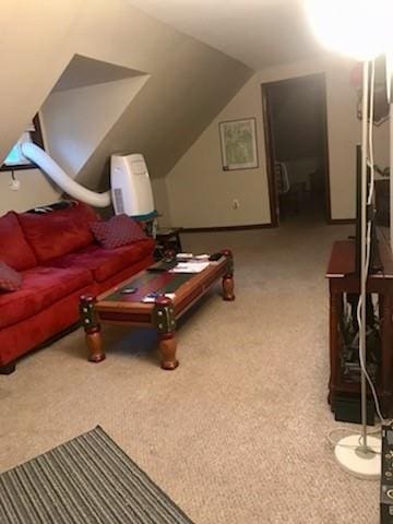 interior space featuring carpet flooring and vaulted ceiling