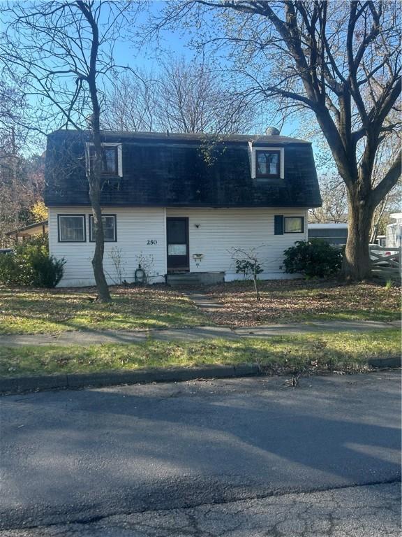 front of property with roof with shingles