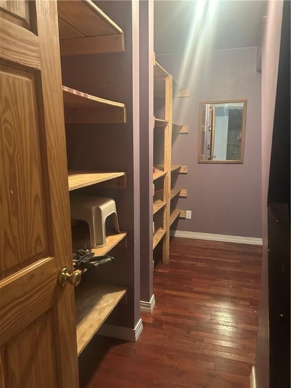 250 Schuyler Ave, Elmira-City, NY 14904 - spacious closet featuring dark wood-style flooring