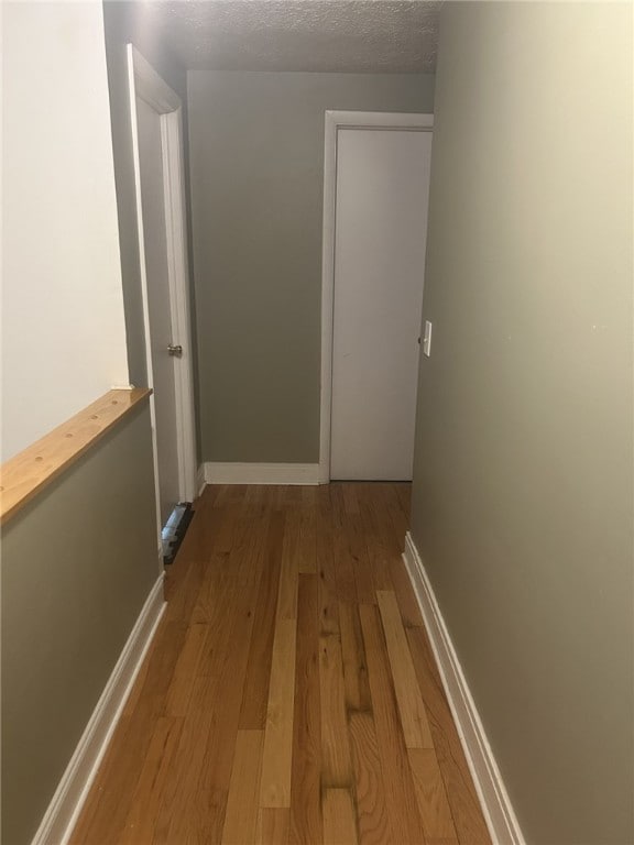 250 Schuyler Ave, Elmira-City, NY 14904 - corridor with wood finished floors and baseboards