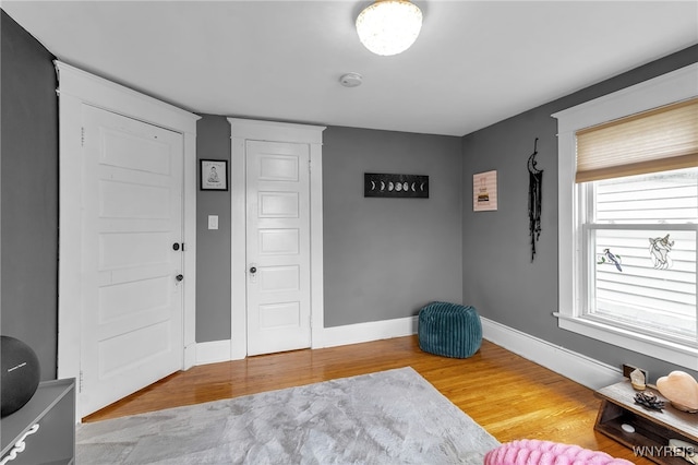 entryway featuring light wood-type flooring and baseboards