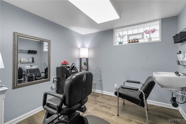 office with baseboards and wood finished floors