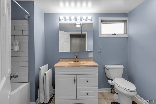 full bath featuring vanity, baseboards, tub / shower combination, and toilet
