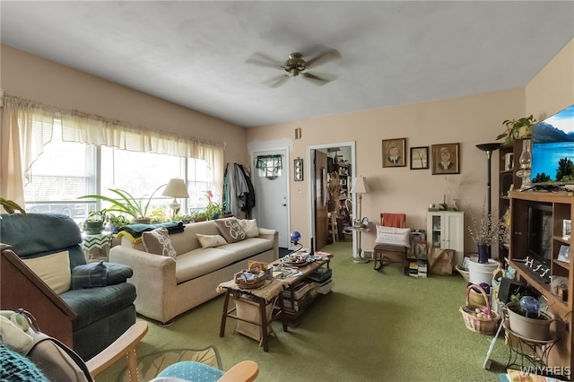 carpeted living area featuring ceiling fan