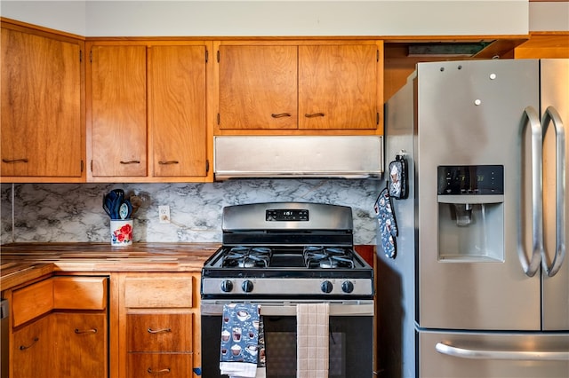 kitchen featuring brown cabinetry, wooden counters, stainless steel appliances, range hood, and backsplash