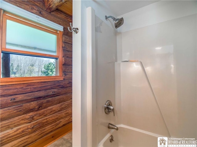 bathroom with bathing tub / shower combination