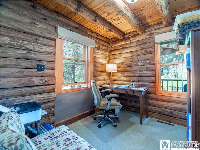home office with visible vents, carpet, wooden ceiling, and beamed ceiling
