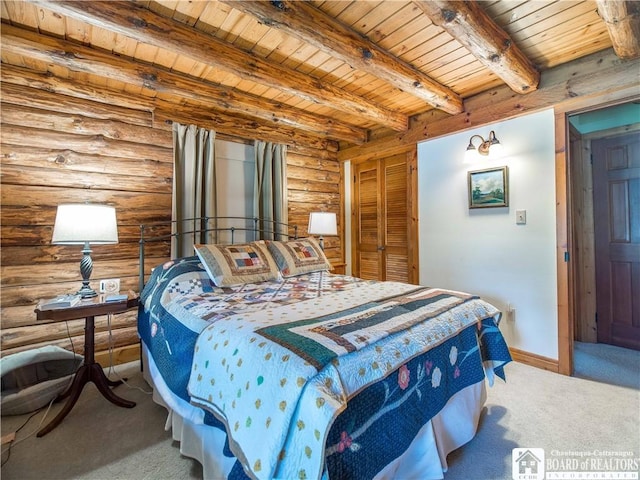 bedroom with carpet flooring, beamed ceiling, baseboards, wooden ceiling, and rustic walls