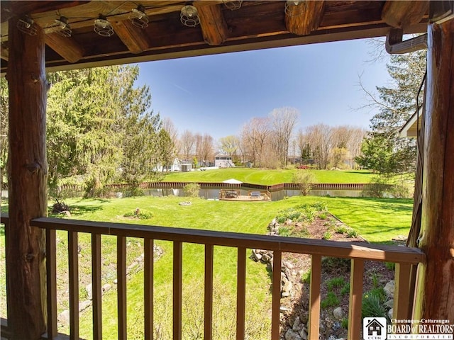 view of yard with a water view and a fenced backyard