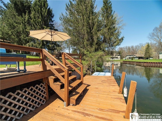 view of dock with a water view