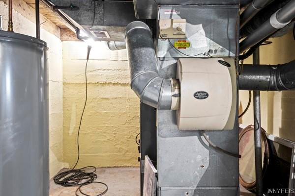 utility room featuring gas water heater