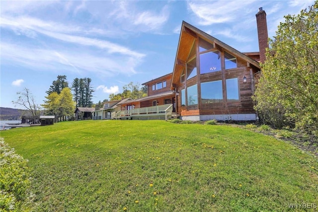 256 W Shore Rd, Cuba, NY 14727 - back of property with a lawn and a chimney