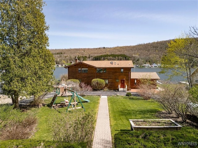 256 W Shore Rd, Cuba, NY 14727 - exterior space with a lawn, a chimney, and a vegetable garden