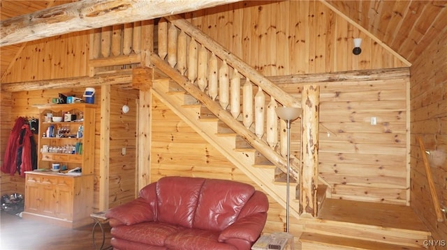 interior space featuring high vaulted ceiling, wood walls, wood ceiling, and wood finished floors