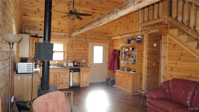 kitchen featuring a wood stove, dark wood-style flooring, wooden walls, wood ceiling, and dishwasher