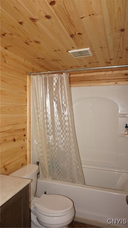 full bath featuring wood ceiling, visible vents, wood walls, toilet, and shower / bath combo with shower curtain