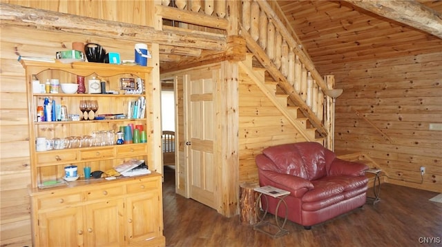 sitting room with wood ceiling, wood walls, wood finished floors, and lofted ceiling