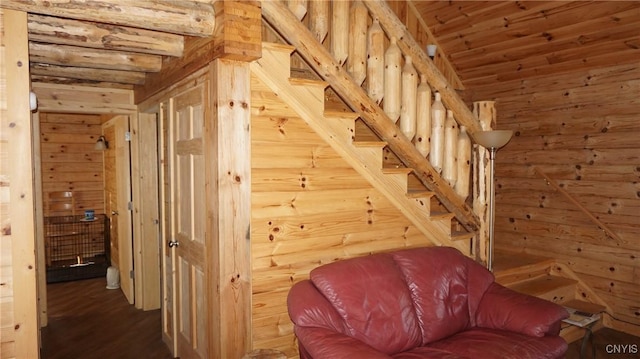 interior space featuring wood walls and wood finished floors