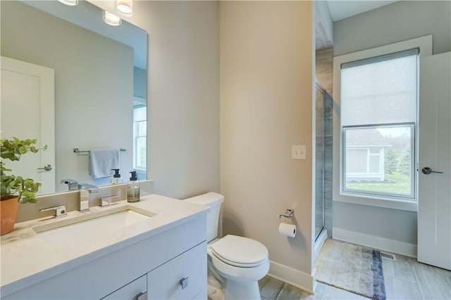 full bath with toilet, visible vents, a healthy amount of sunlight, and a stall shower