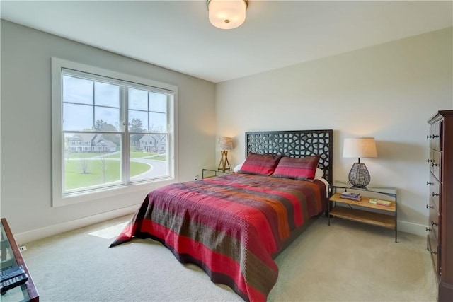 carpeted bedroom with baseboards