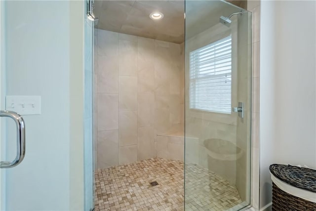 full bath with recessed lighting and a shower stall